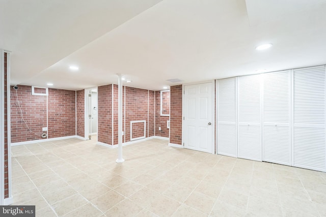 basement with brick wall