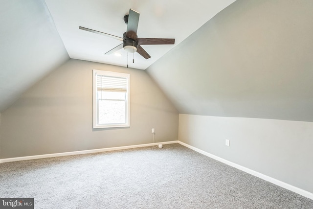 additional living space featuring vaulted ceiling, ceiling fan, and carpet floors