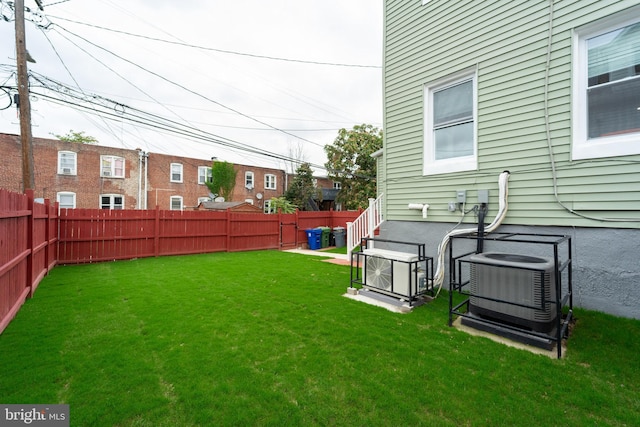 view of yard with central AC unit