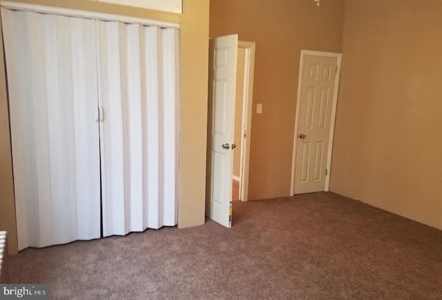 unfurnished bedroom featuring carpet