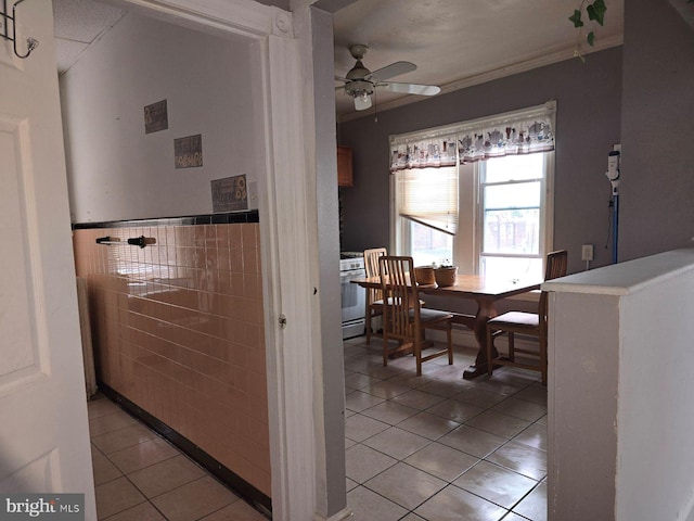 interior space featuring tile walls and light tile patterned floors