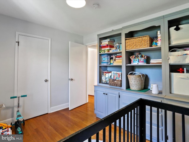 hallway with light hardwood / wood-style flooring