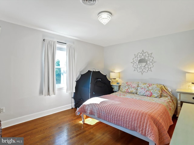 bedroom featuring dark wood-type flooring