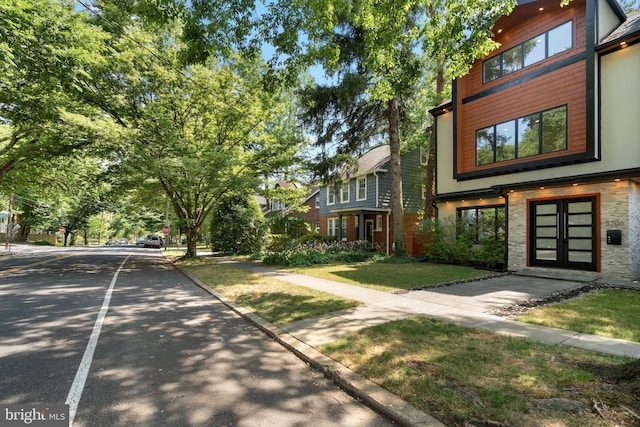 view of home's community featuring a yard