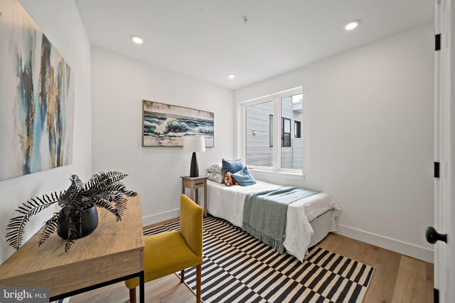 bedroom featuring light wood-type flooring