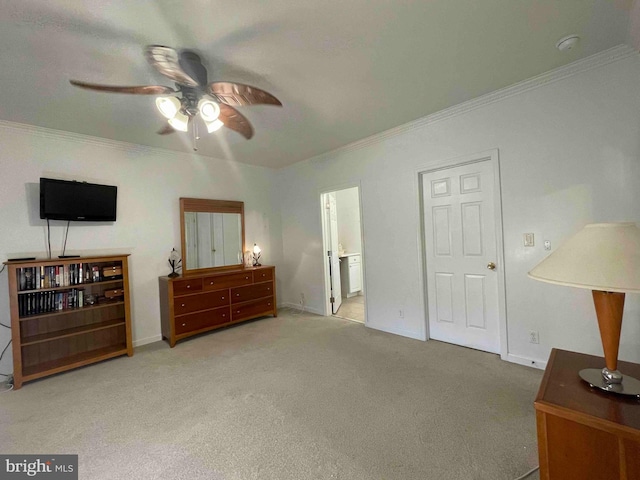 bedroom with carpet, crown molding, and ensuite bathroom