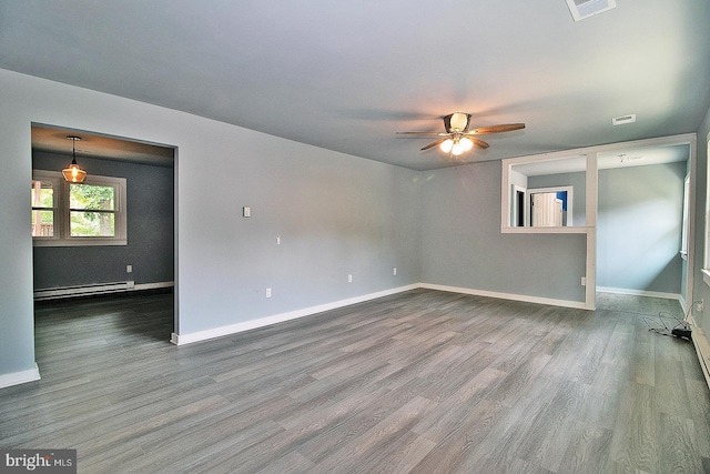 unfurnished room with baseboard heating, hardwood / wood-style floors, and ceiling fan