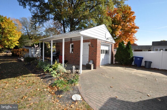 exterior space featuring an outdoor structure and a garage