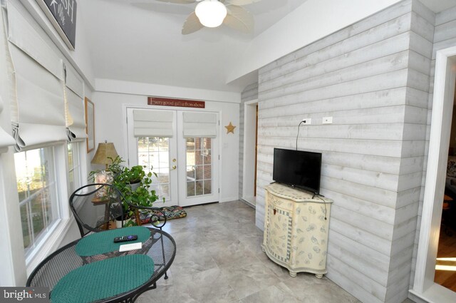 sunroom with french doors and ceiling fan