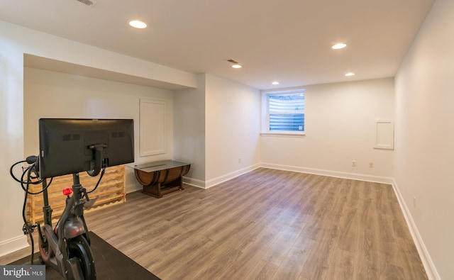 workout room with wood-type flooring