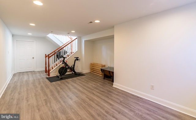 unfurnished living room with wood-type flooring