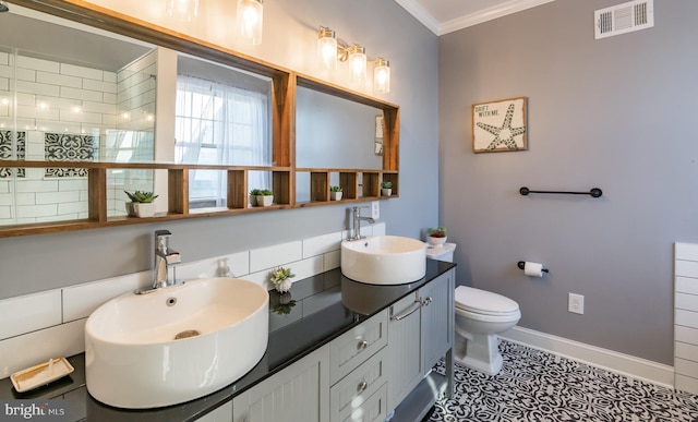 bathroom featuring ornamental molding, vanity, tile patterned flooring, and toilet