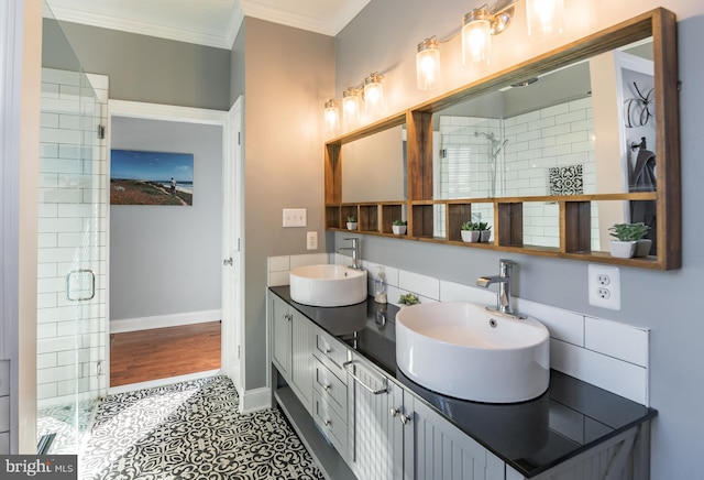 bathroom featuring ornamental molding, tile patterned floors, walk in shower, and vanity