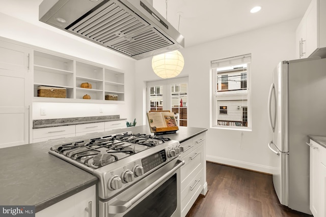 kitchen with white cabinetry, stainless steel appliances, decorative light fixtures, custom range hood, and dark wood-type flooring