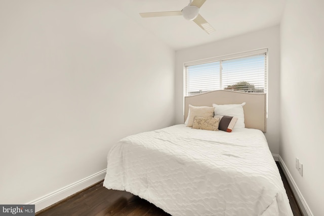 bedroom featuring ceiling fan, vaulted ceiling, and dark hardwood / wood-style flooring