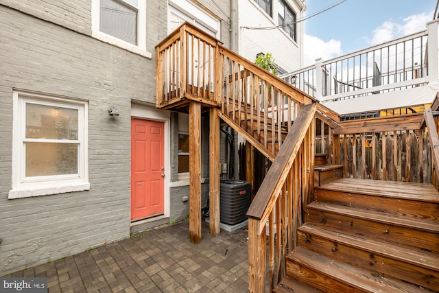 property entrance featuring a patio area and a deck