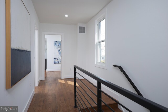 hallway with dark wood-type flooring