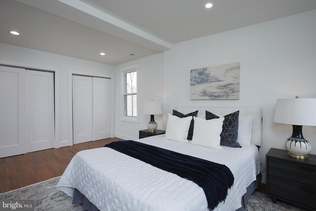 bedroom with dark wood-type flooring