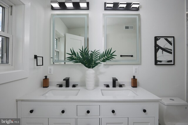 bathroom with vanity and toilet