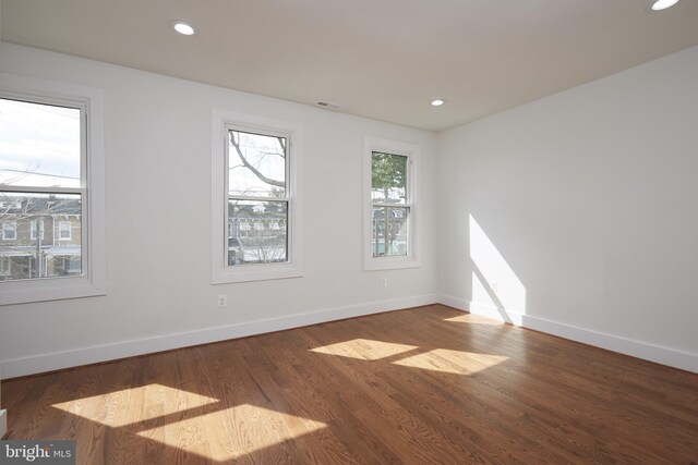 spare room featuring hardwood / wood-style flooring