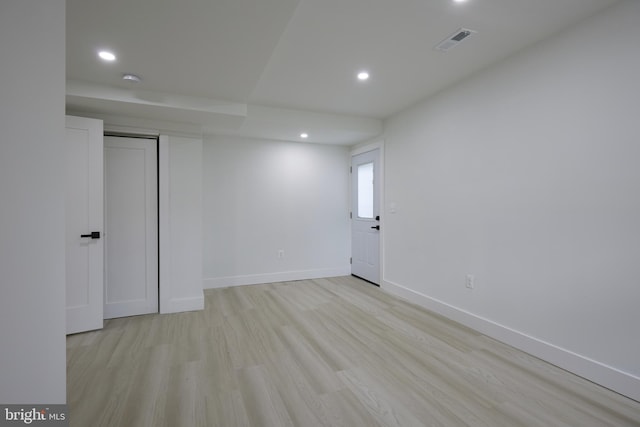 spare room featuring light hardwood / wood-style flooring