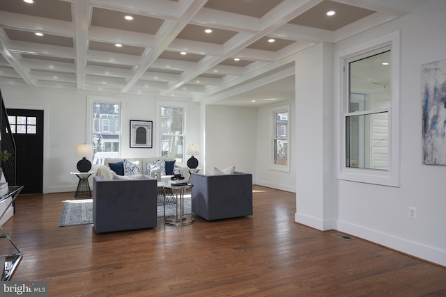 living room with beam ceiling, dark hardwood / wood-style flooring, and coffered ceiling