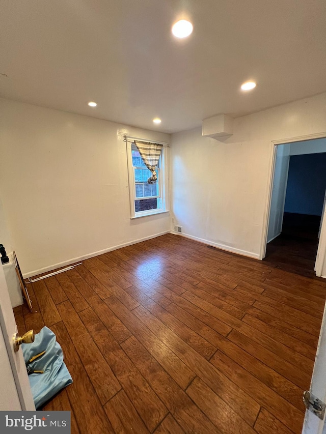 empty room featuring dark hardwood / wood-style floors