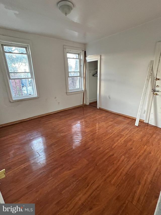 unfurnished bedroom featuring hardwood / wood-style floors