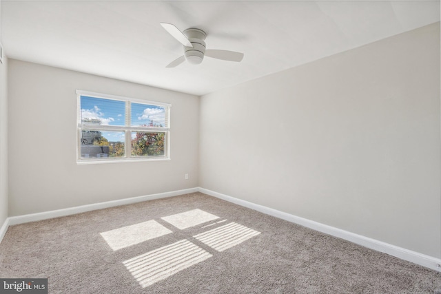 empty room with carpet floors and ceiling fan