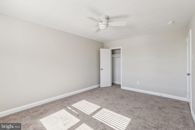 unfurnished bedroom featuring a closet, ceiling fan, and light carpet