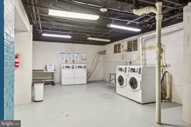 washroom with independent washer and dryer