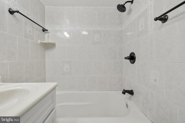 bathroom featuring vanity and tiled shower / bath combo