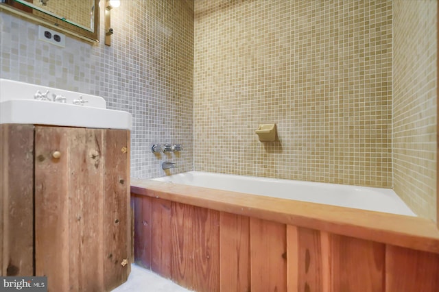 bathroom featuring a tub to relax in