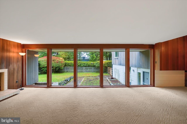 unfurnished room with wooden walls