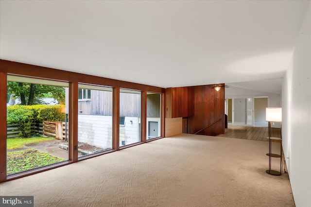 unfurnished room featuring light carpet and ceiling fan