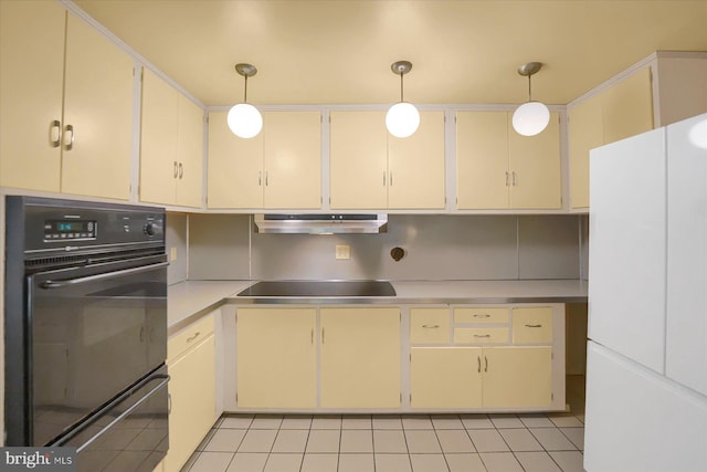 kitchen with backsplash, hanging light fixtures, light tile patterned floors, and black appliances