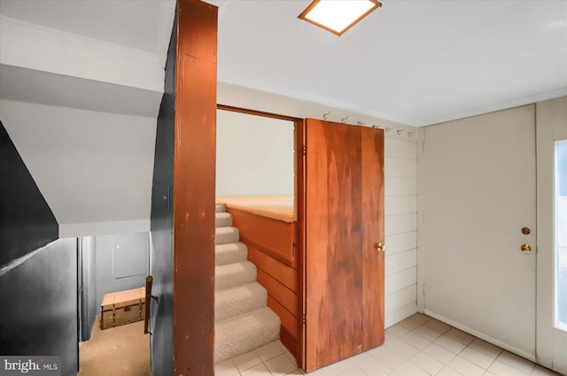 stairway featuring tile patterned flooring