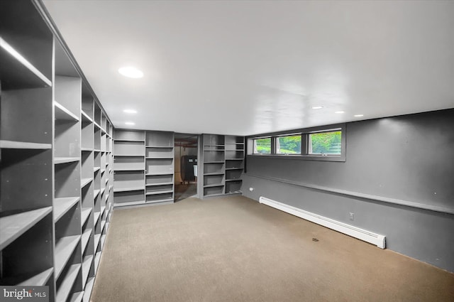 walk in closet with carpet flooring and baseboard heating