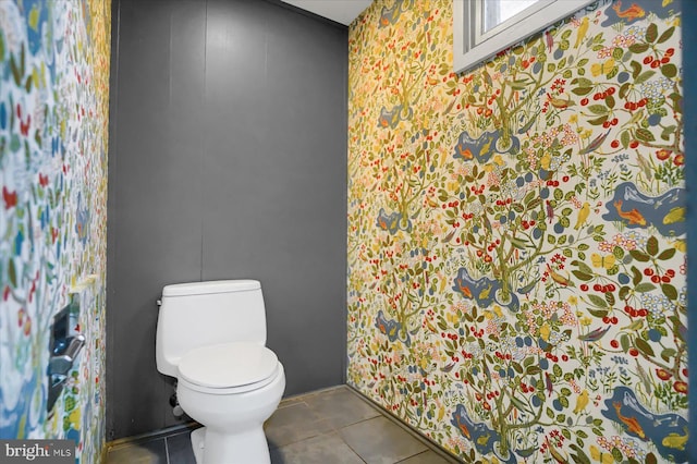 bathroom with tile patterned floors and toilet