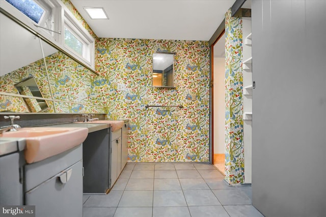 bathroom with vanity and tile patterned flooring