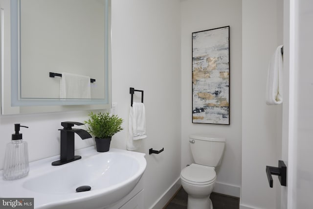 bathroom with toilet and sink