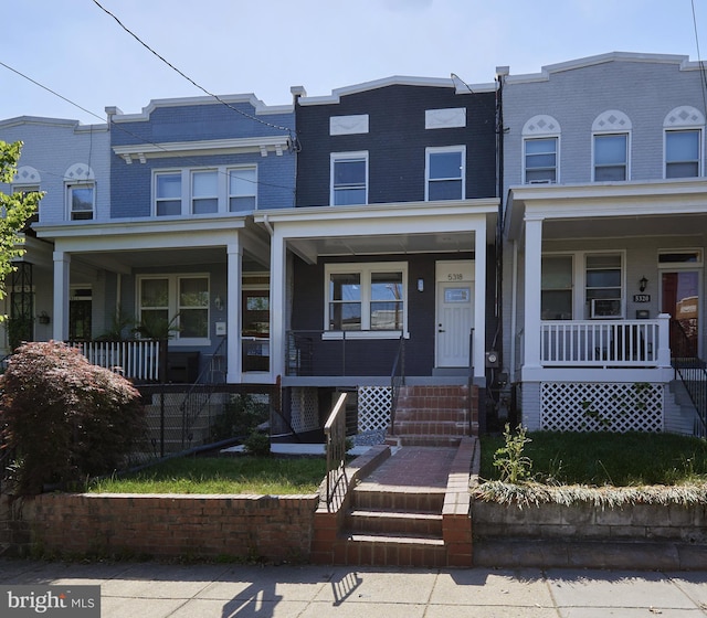 view of property featuring covered porch