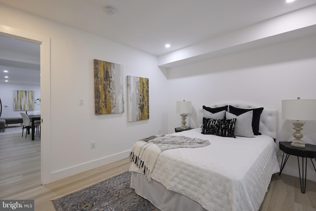 bedroom with light wood-type flooring