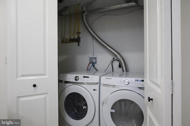 laundry room with separate washer and dryer