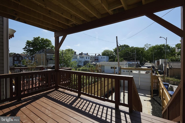 wooden deck featuring a garage