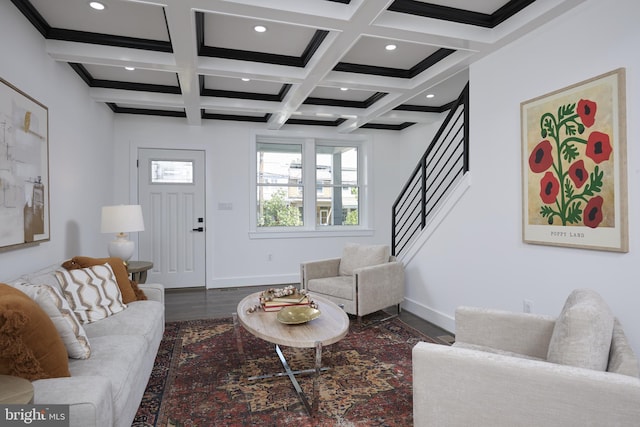 living room featuring beam ceiling, coffered ceiling, and hardwood / wood-style floors