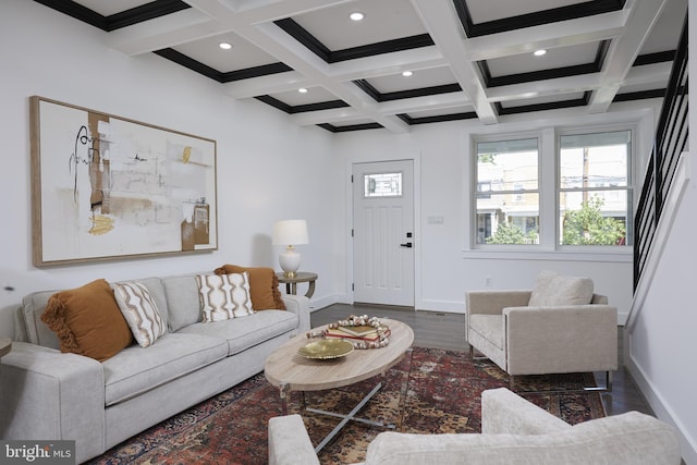 living room featuring ornamental molding, beam ceiling, coffered ceiling, and dark hardwood / wood-style flooring