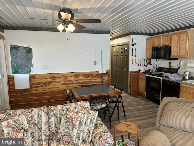 kitchen featuring wood-type flooring, black appliances, and ceiling fan