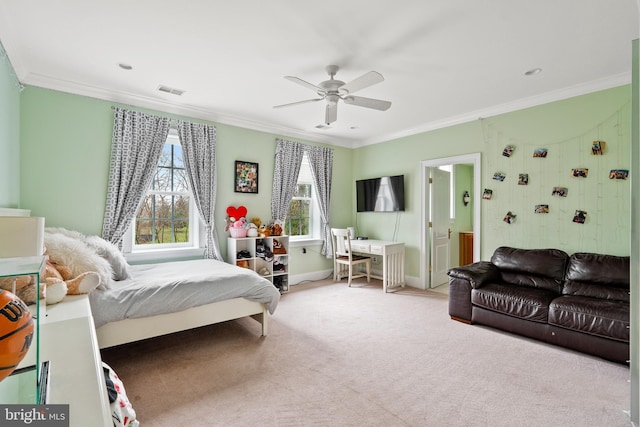 carpeted bedroom with ceiling fan and crown molding