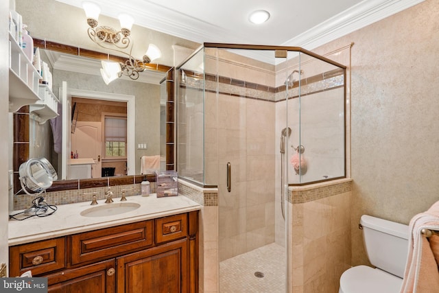 bathroom with walk in shower, ornamental molding, toilet, and vanity